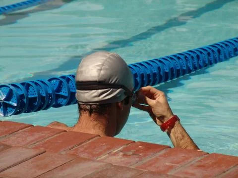 Swimmer resting Stock Photos