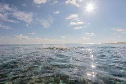 Swimmer splashing in sunny, idyllic ocean, Maldives Stock Photos