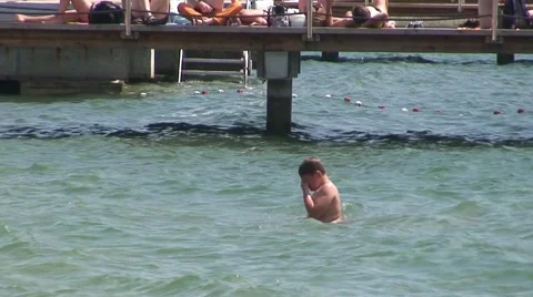 Swimmer Standing in Sea Stock Footage 1060941