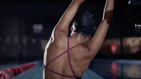 Swimmer stretching in a pool Stock Footage 275617646