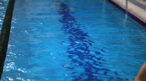 Swimmer swims away from the camera Stock Footage 33613043