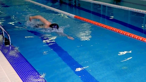 Swimmer in training in the pool performs a U-turn Stock-Footage 99181042