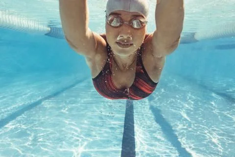 Swimmer training in the pool Stock Photos
