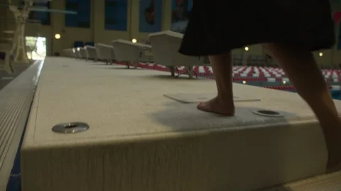 Swimmer Walking To Starting Block 스톡 동영상 105934653