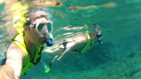 Swimmers below-above surface 60% Stock-Footage 24592315