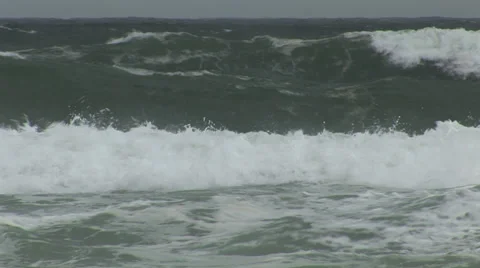 Swimmers in dangerous surf Stock Footage 26310627