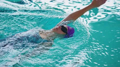 A Swimmers Journey: Capturing the Grace and Serenity of Floating in Crystal Stock Footage 317094698