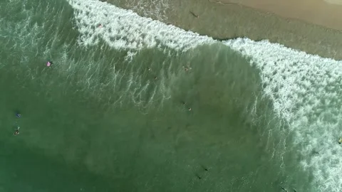 Swimmers In The Ocean Lapping Waves Aerial 4k Drone Stock Footage 256684489