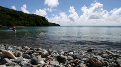 Swimmers play off the coast Stock Footage 41378868
