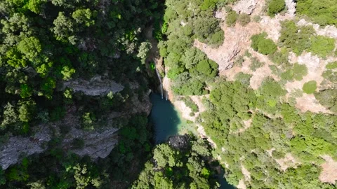 Swimmers in Polylimnio Waterfall Pool Stock-Footage 334899706