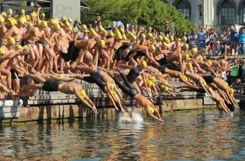 Swimmers on the start of open waters Stock Photos