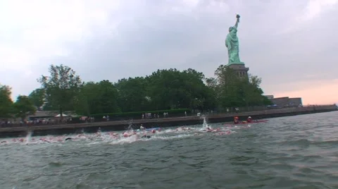SWIMMERS BY STATUE OF LIBERTY Video stock 51136231