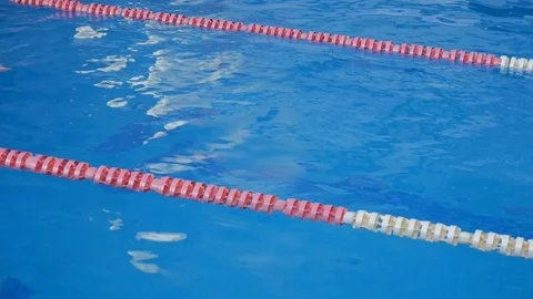 Swimmers Swim In a Pool On Its Back Stock Footage 72183886