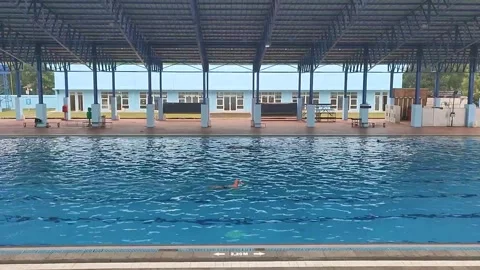 Swimmers Training at Tirta Krida Swimming Pool Stock Footage 336829341