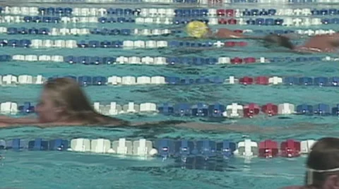 SWIMMERS WARM UP SHOT FROM SIDE OF POOL - SPORTFILM 10069A Stock Footage 51056186