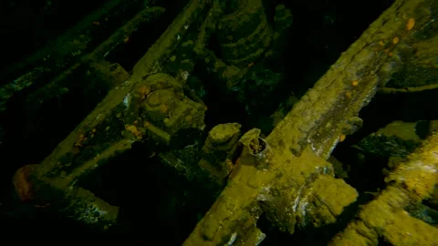 Swimming along engine inside underwater shipwreck Stock Footage 253492041