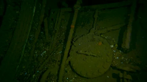 Swimming along inside of large underwater shipwreck Stock Footage 253497182