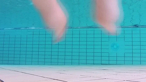 Swimming away from the underwater camera Stock Footage 87932369