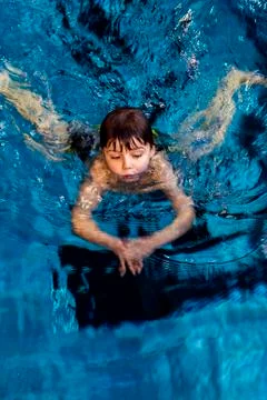 Swimming boy Stock Photos