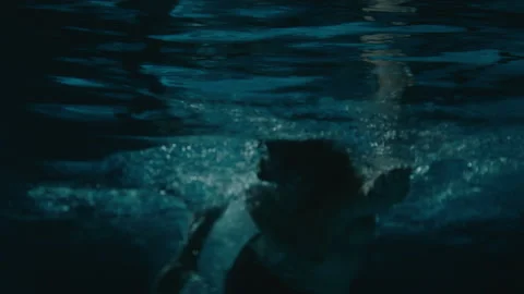 Swimming in the dark Stock Footage 169197320
