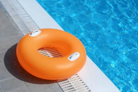 Swimming float ring at the poolside Stock Photos
