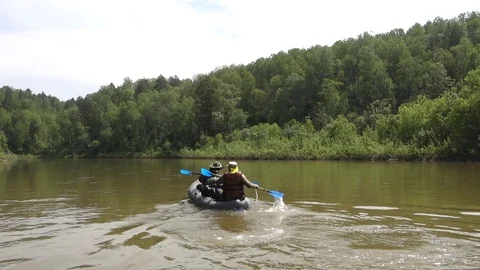 Swimming on an inflatable kayak Video stock 107031983
