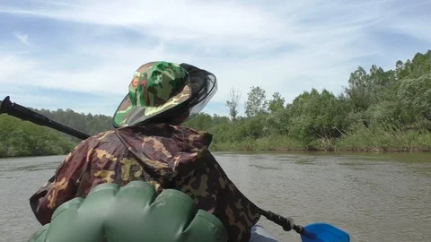 Swimming on an inflatable kayak Video stock 107032713