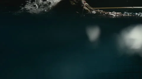 Swimming at night underwater Stock Footage 169099337