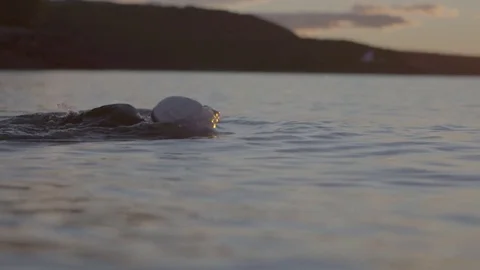 Swimming in ocean at sunrise Stock-Footage 74116089