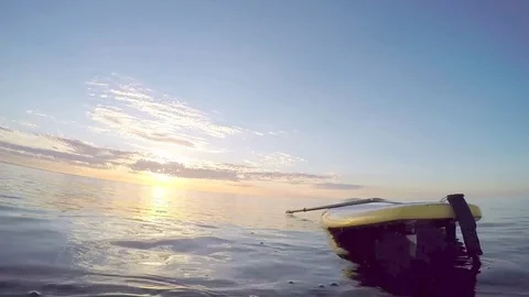 Swimming with paddle board Stock Footage 77496470