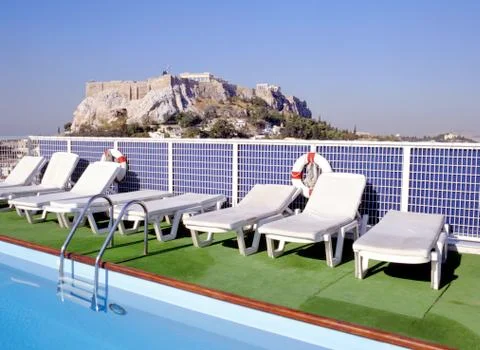 Swimming pool with Acropolis at background Stock Photos