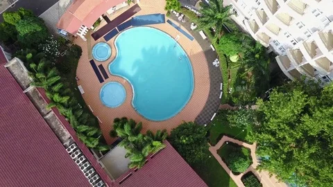 Swimming pool on a background of a multi-storey hotel building 動画素材 76238845