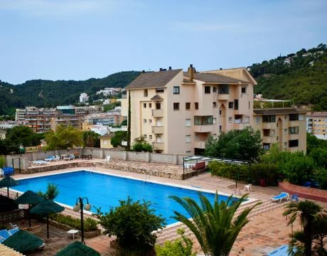 Swimming pool in the backyard Stock Photos