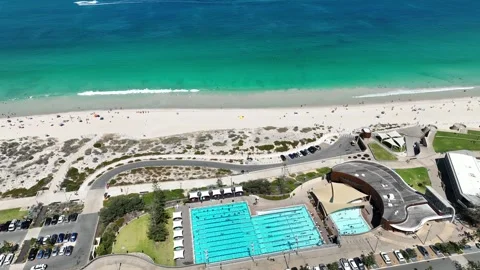 Swimming Pool by beach ocean waves Scarborough Perth Aerial 4K Stockbeeldmateriaal 265867089