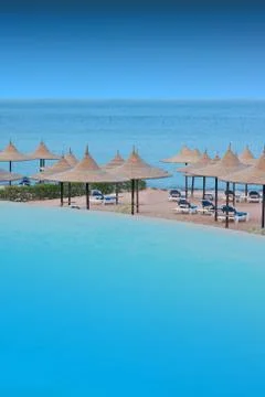 Swimming pool on the beach Stock Photos