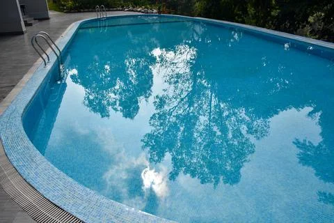 Swimming pool with blue and clear water Stock Photos