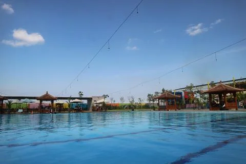 Swimming pool with blue sky background Stock Photos