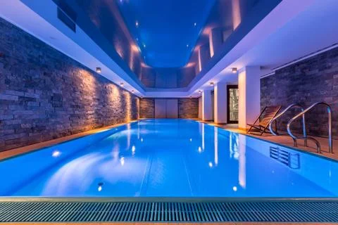 Swimming pool with brick wall Stock Photos