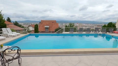 Swimming pool with city view Stock Footage 139986670
