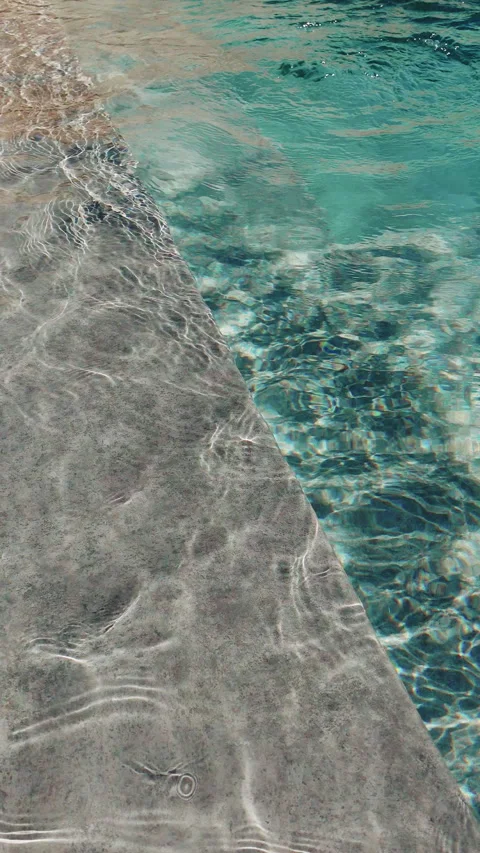 Swimming pool with crystal-clear and clean water where the water moves Video stock 280477095
