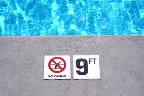 Swimming pool depth marker Stock Photos