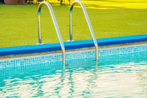 Swimming pool at the edge of the pool. Stock Photos