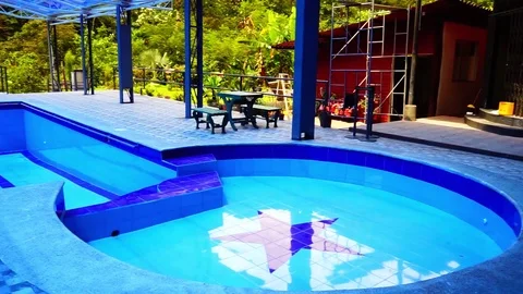 A swimming pool that is empty and is still under construction. Stock Footage 106240655