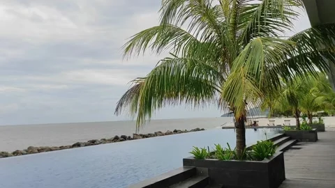 A swimming pool facing the ocean Stock Footage 269690617