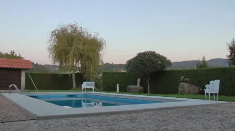Swimming pool garden sunset Stock Footage 22679834