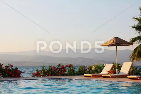 Swimming Pool at a High End Beach Resort Hotel Stock Photos