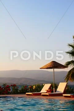 Swimming Pool at a High End Beach Resort Hotel Stock Photos