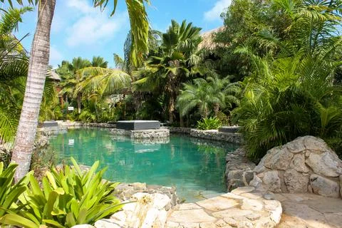 Swimming pool of a hotel with elevated sunbed, Curacao Stock Photos