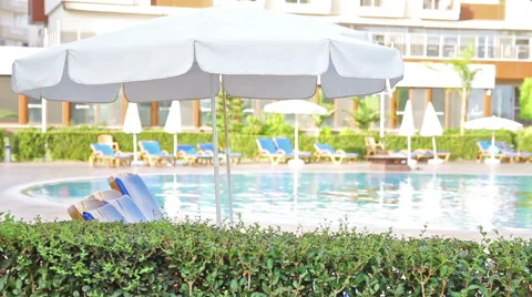 Swimming Pool. Hotel, Vacation, Waves, Umbrella, Tourism, Travel, Relax, Resort. Stock Footage 56846945