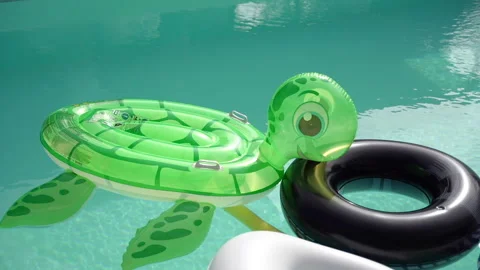 Swimming pool. Inflatable toys float in the pool. Stock Footage 208768437
